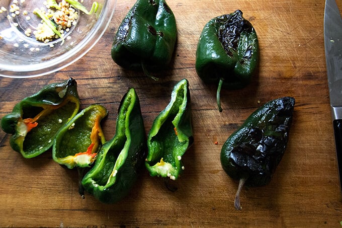 Halved, blistered poblano peppers. 