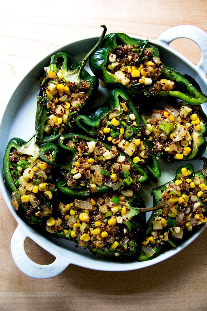 Poblano peppers stuffed with corn-quinoa mixture ready to be baked.
