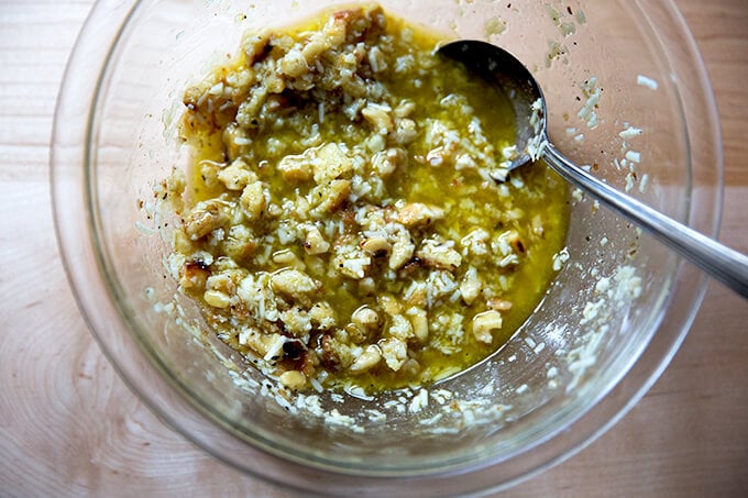 A bowl with walnut salsa all stirred together. 