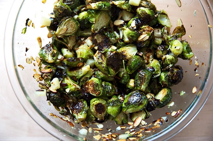 A bowl of roasted Brussels sprouts, almonds, and Manchego all tossed together.