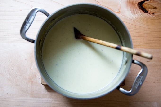 An overhead shot of a pot of cream of celery soup.