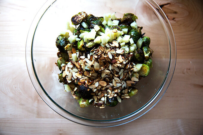A bowl of roasted Brussels sprouts, almonds, Manchego. 