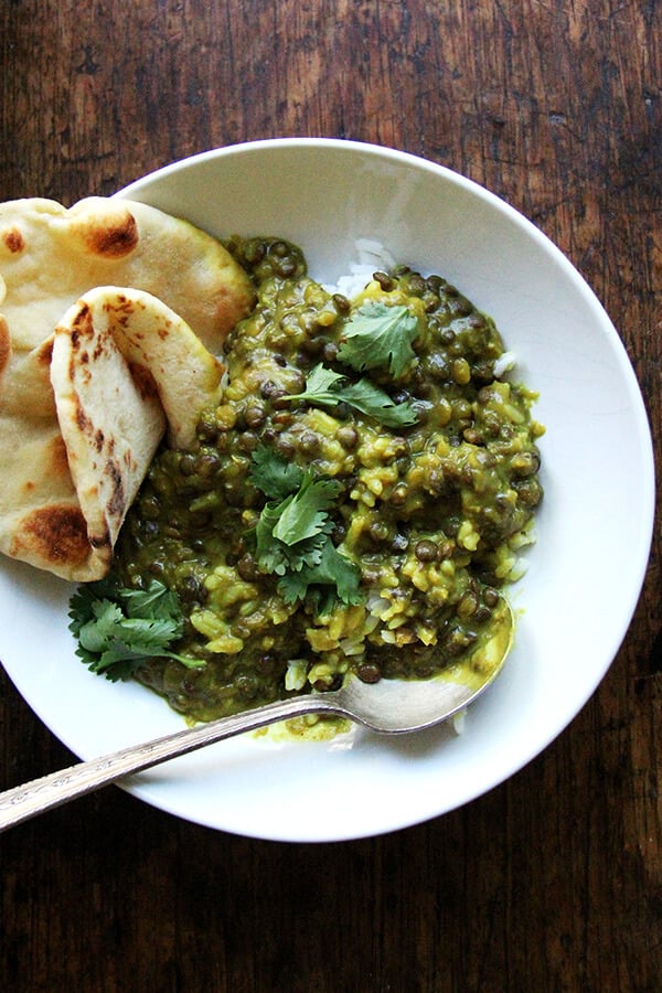 A bowl of curried lentils with coconut milk.