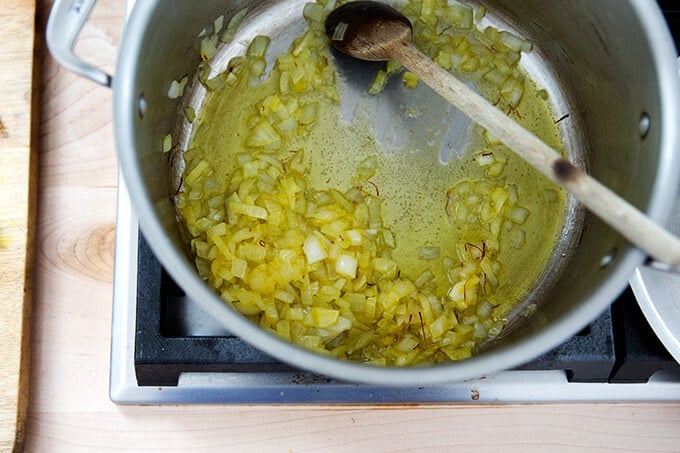 Onions sweating with olive oil and saffron.