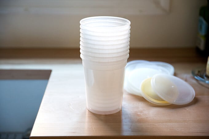 Quart containers in a stack on a counter.