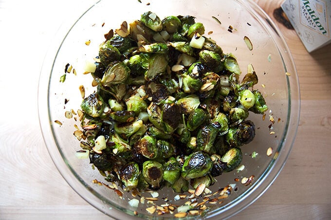 A bowl of roasted Brussels sprouts, almonds, and Manchego all tossed together.