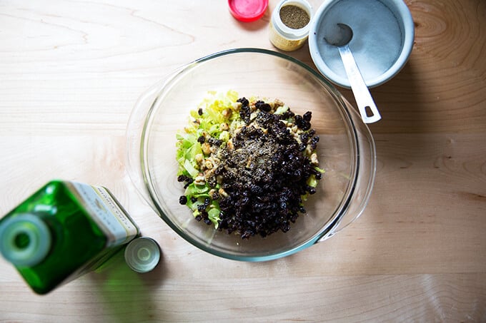 An overhead shot of the ingredients to make celery walnut salsa.