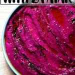 A bowl of beet dip with labneh and za'atar.