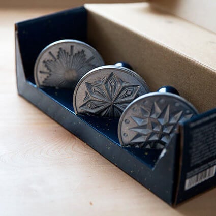 Nordic Ware Starry Night Cookie Stamp Set on a countertop. 