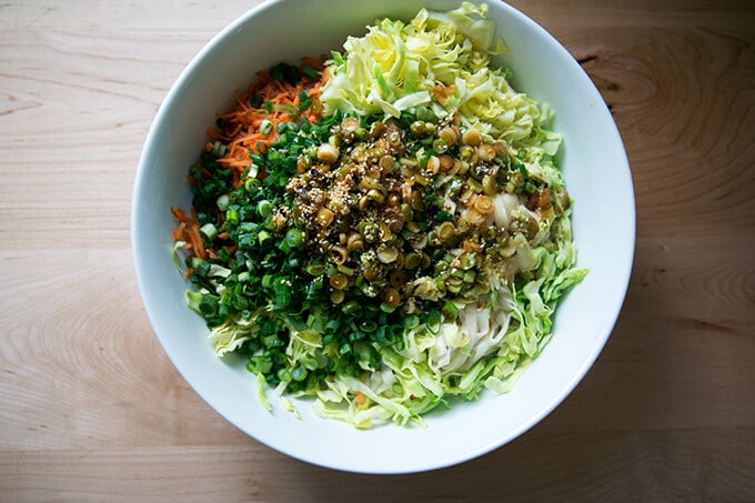 How to make Chinese noodles with chilies, scallions, and cabbage.