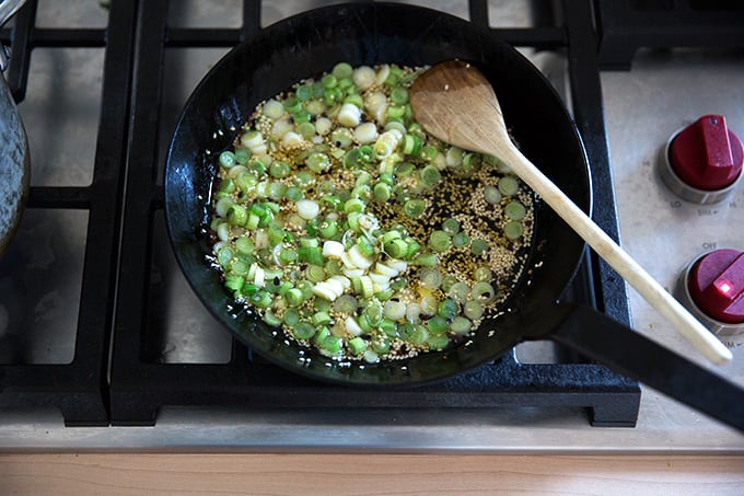 How to make Chinese noodles with chilies, scallions, and cabbage.