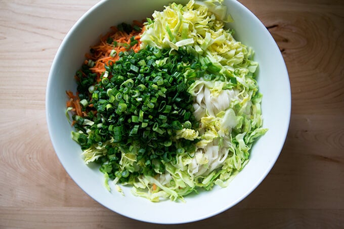 How to make Chinese noodles with chilies, scallions, and cabbage.