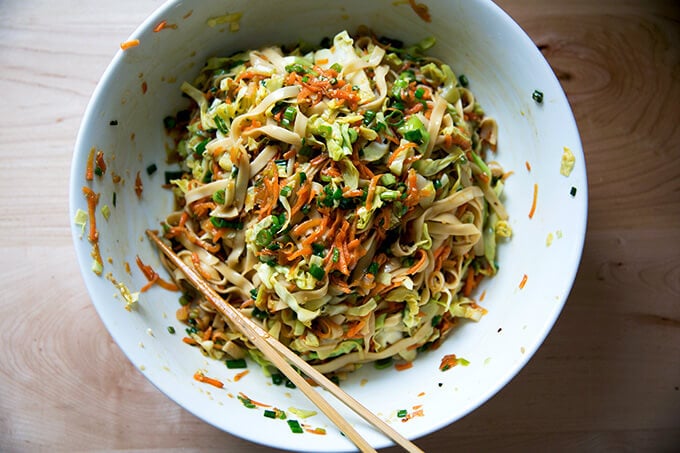 How to make Chinese noodles with chilies, scallions, and cabbage.