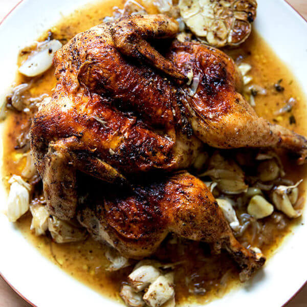A plate of Dorie Greenspan's oven-roasted spatchcocked chicken with za'atar and lemon.