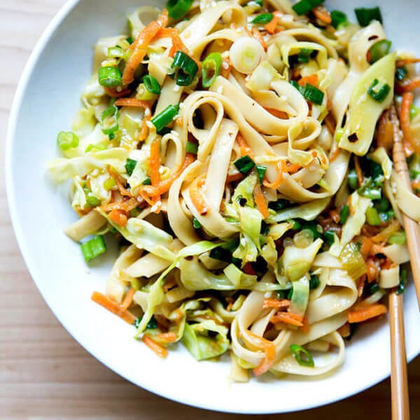 How to make Chinese noodles with chilies, scallions, and cabbage.