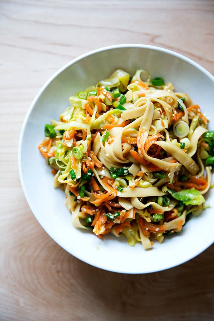 How to make Chinese noodles with chilies, scallions, and cabbage.