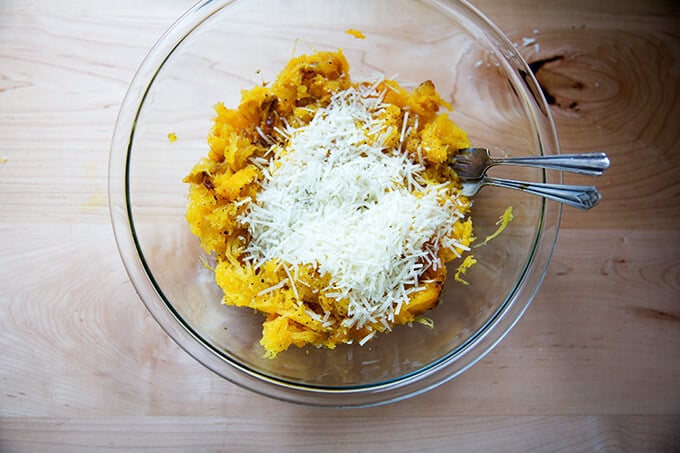 adding the pecorino to the roasted spaghetti squash