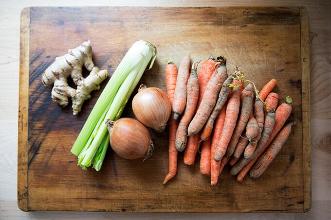ingredients for vegan carrot-ginger soup with curry and coconut milk