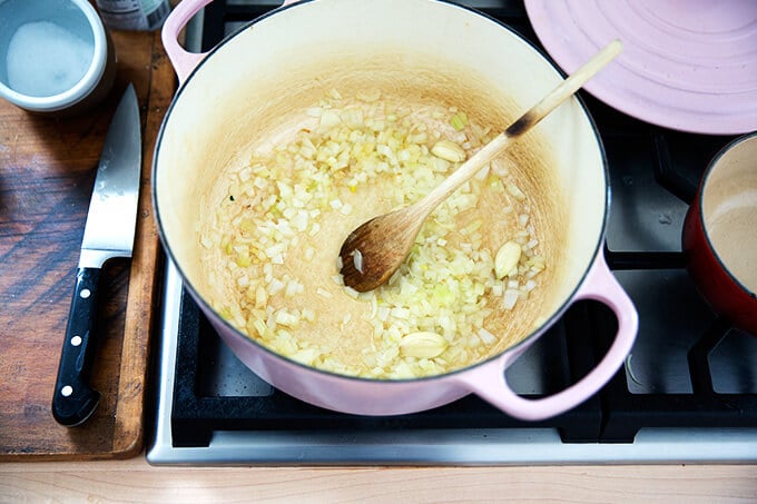 sautéeing the onion and garlic in coconut oil in a dutch oven stovetop