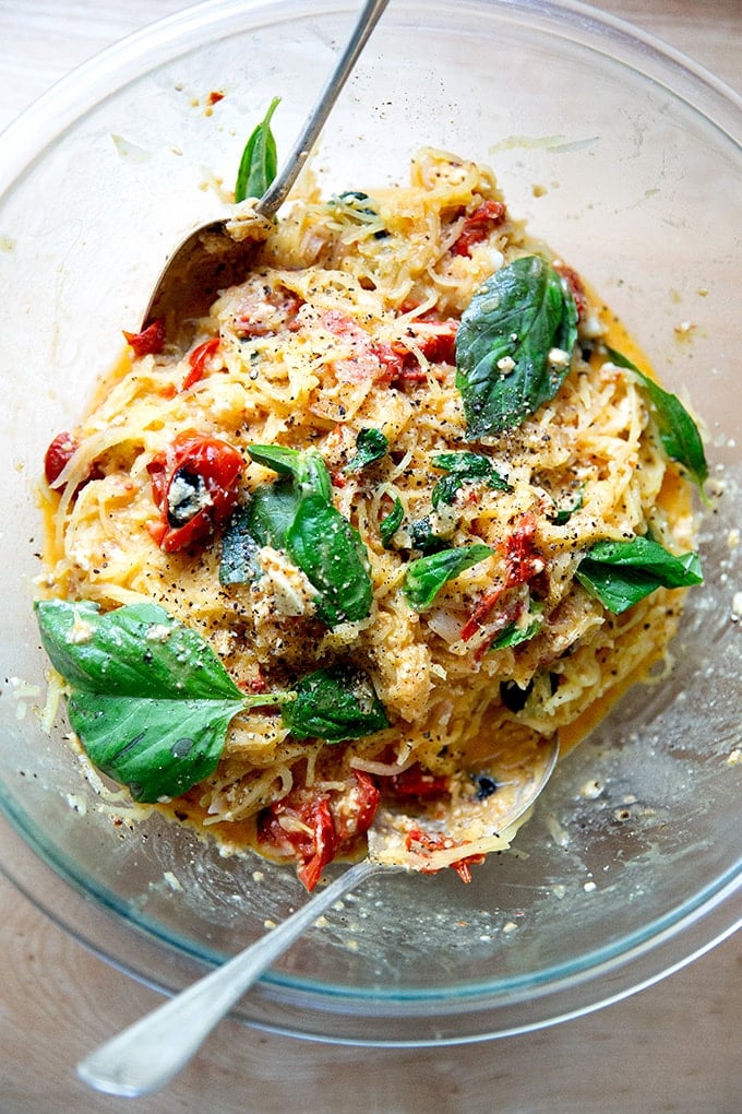 Spaghetti squash tossed with baked feta and tomatoes.