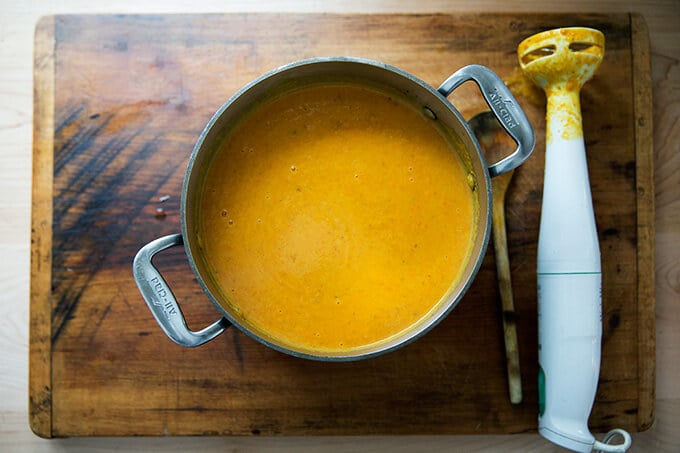 puréed vegan carrot-ginger soup with curry and coconut milk
