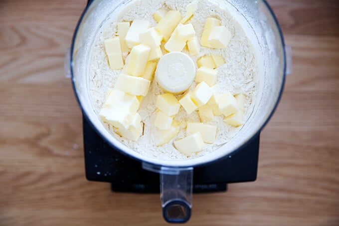 adding the butter for the crust to the food processor