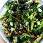 charred broccoli salad with dates, almonds, and cheddar