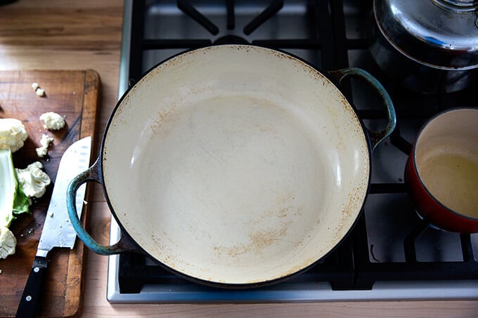 Le Creuset braiser, freshly cleaned on the stovetop.