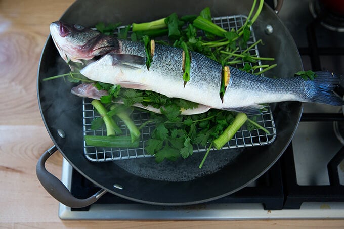 steaming the branzino in the wok