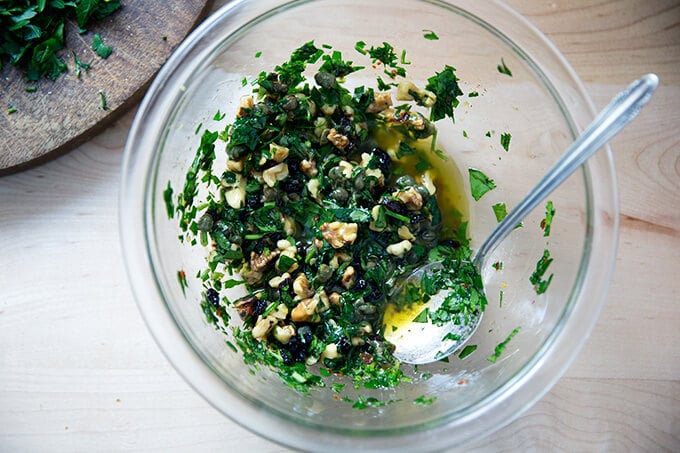 walnut-caper salsa in a small glass bowl