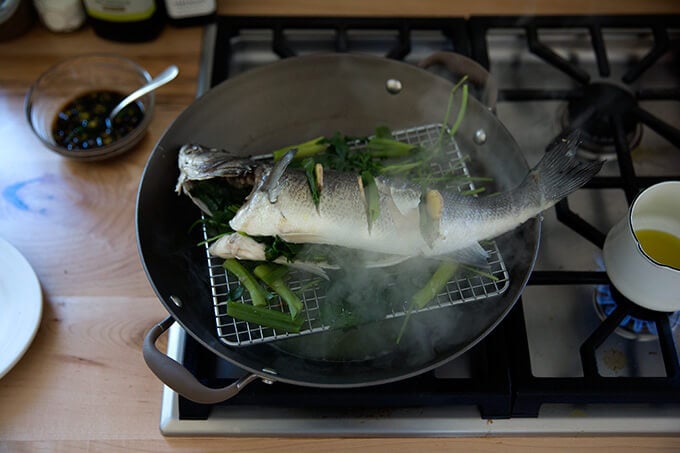 steaming the branzino in the wok