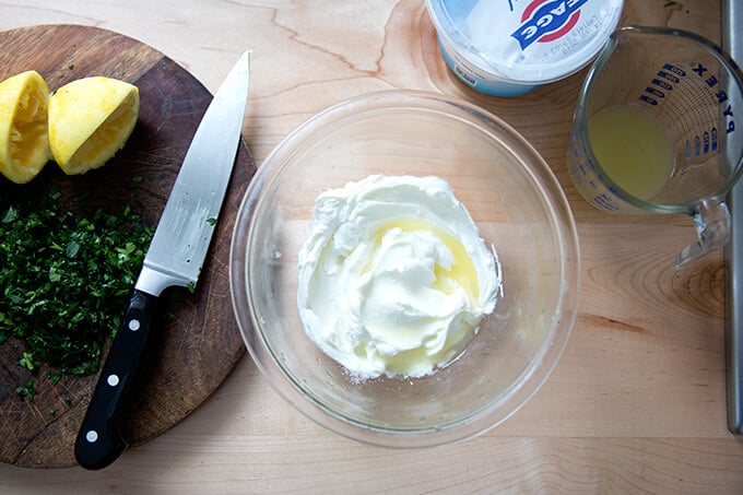 yogurt and fresh lemon in a small glass bowl