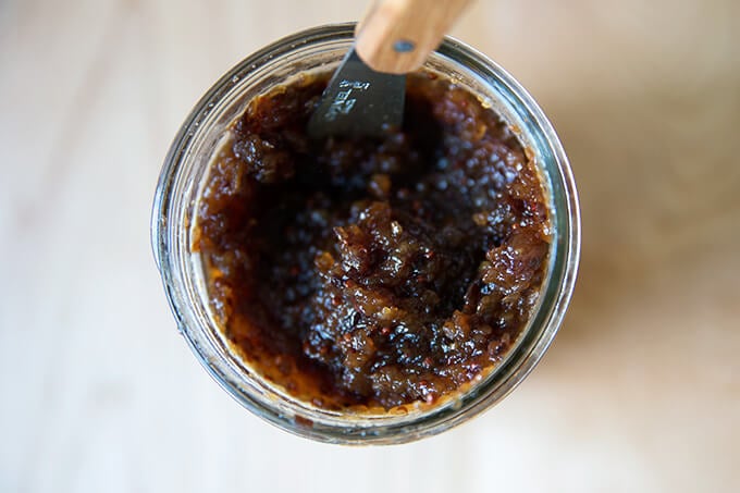 Homemade apple chutney recipe in a glass mason jar.