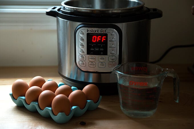 The Instant Pot 6-qt IP Duo with uncooked eggs and water.