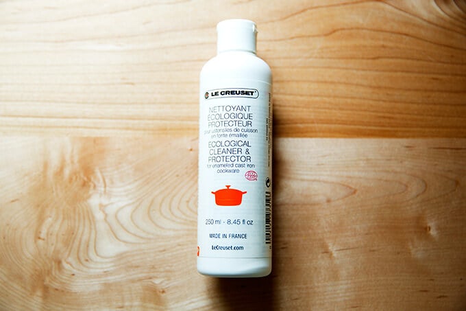 A bottle of Le Creuset enameled cast iron pan cleaner.