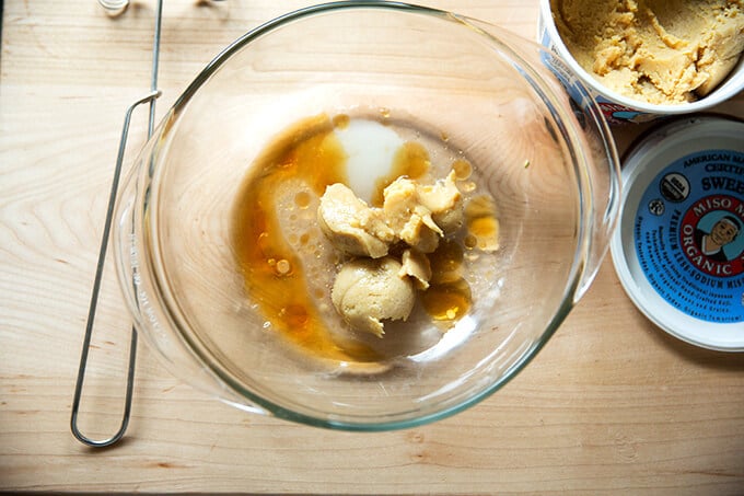 A bowl of miso, mirin, sesame oil, sugar, and water.