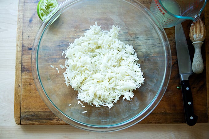 A bowl of day-old basmati rice with lime and salt.