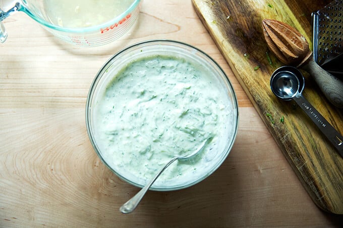 A bowl filled with cucumber-yogurt sauce.