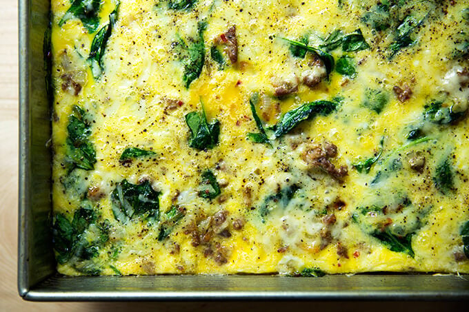 A very nice breakfast casserole with eggs, Gruyere, sausage, spinach, and onions.