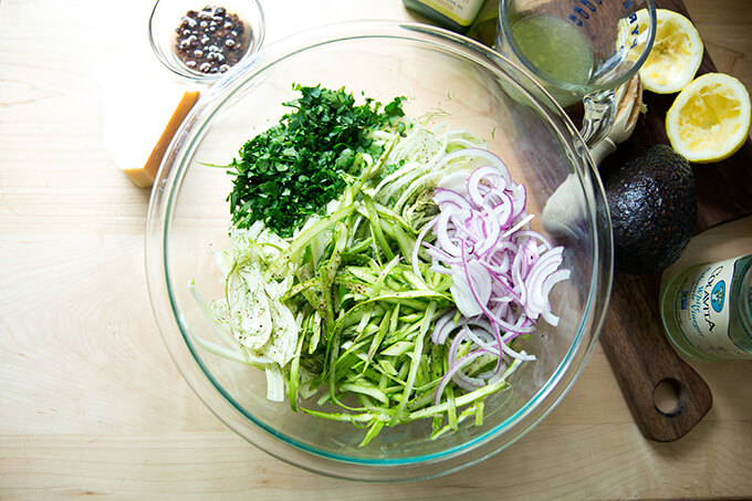 All of the ingredients for the shaved fennel salad in a bowl.
