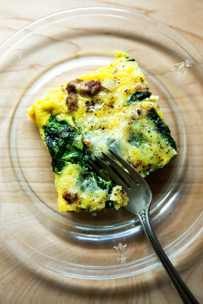 slice of sausage, spinach and egg casserole