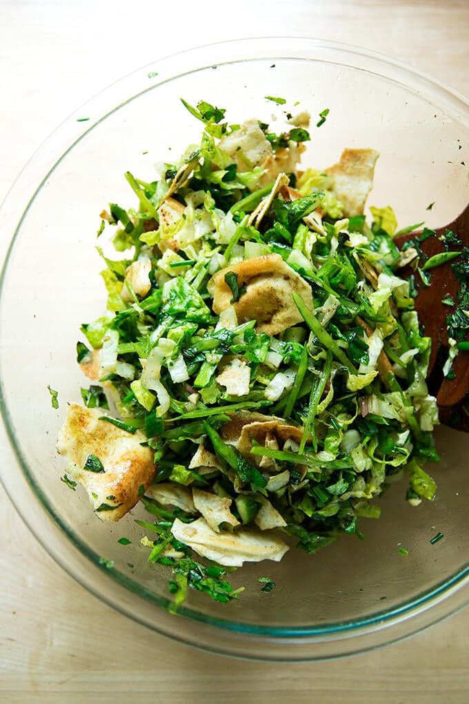 A bowl with a spring fattoush salad all tossed together. 