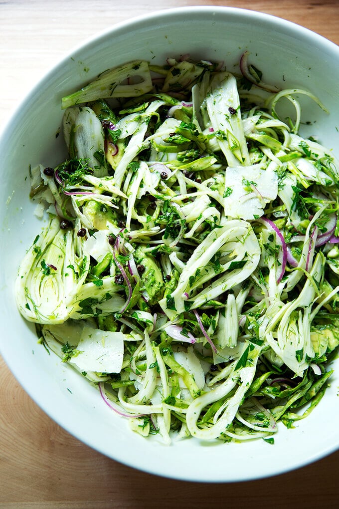 A bowl of shaved fennel salad with parmesan.