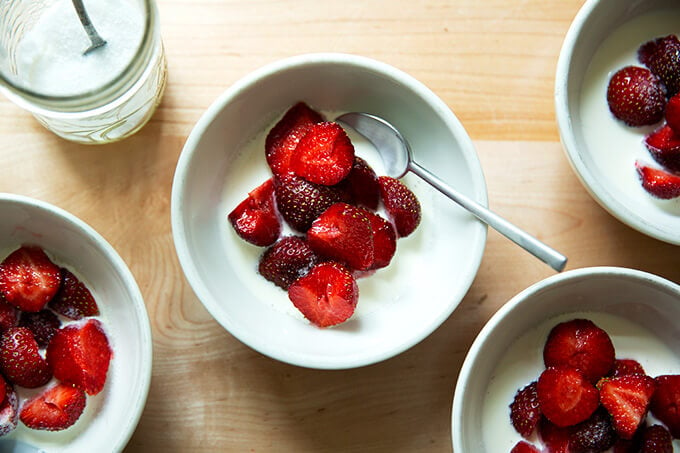 4 bowls of strawberries + sugar + cream