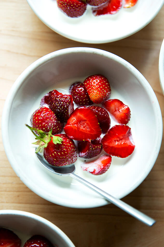 A bowl of strawberries and cream.