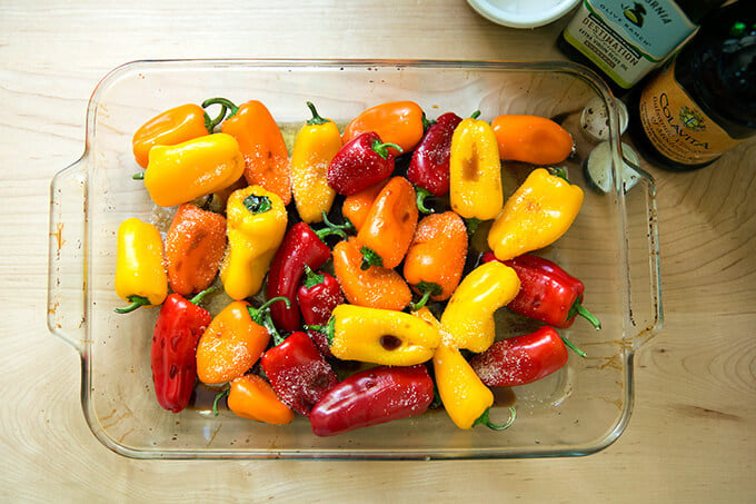 A pan of peppers dressed in olive oil, balsamic, and salt.