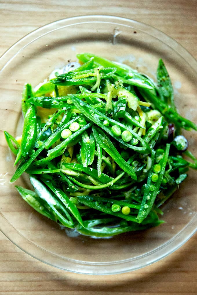 A plate of sugar snap pea salad with buttermilk dressing. 