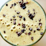 An overhead shot of a coffee smoothie made with banana, dates, and almond butter.