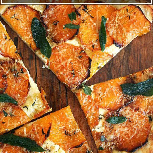 A butternut squash and crispy sage pizza cut into quarters.