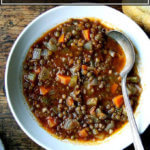 A bowl of one-pot, vegan lentil soup.